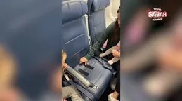 Uçakta bebeğini koltuğa bantladı! Binlerce yorum geldi: Bu yasal mı?