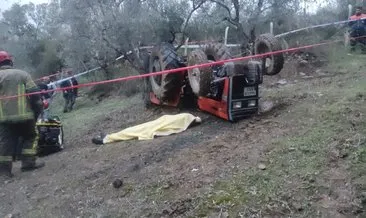 Devrilen traktörün altında kaldı