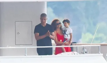 Çocuk kucakta baba balık avında