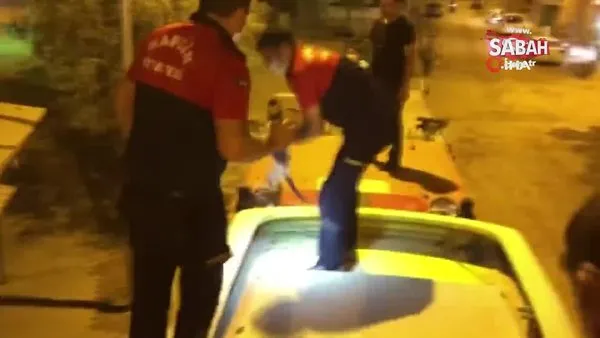 Mardin'de halk otobüsü klima motoruna sıkışan kediyi itfaiye erleri kurtardı | Video