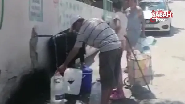 İzmir Dikili'de yaklaşık 36 saattir devam eden su kesintisine vatandaşlardan bidonlu çözüm | Video