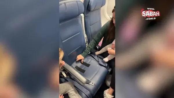 Uçakta bebeğini koltuğa bantladı! Binlerce yorum geldi: 