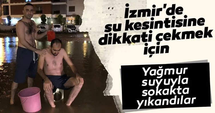 İzmir’de su kesintisine dikkati çekmek için yağmur suyuyla sokakta yıkandılar