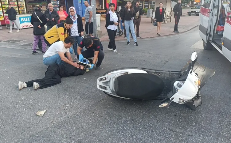 Kırmızı ışık ihlali yapan motosikletli kız kaza yaptı: Dakikalarca yerde kıvrandı!