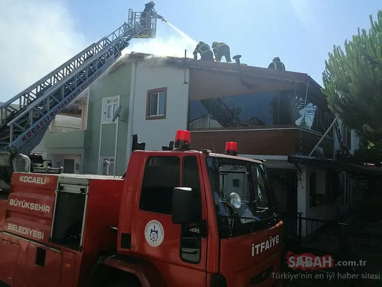 Bahçe hortumu ile çatıya çıkıp yangını söndürmeye çalıştı