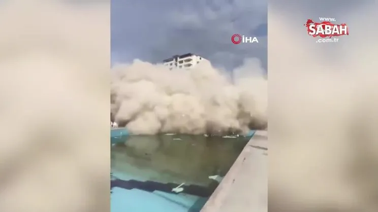 13 katlı bina iş makinesinin darbesiyle yerle bir oldu: Yaşanan panik kamerada | Video