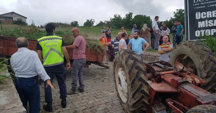 Devrilen traktörün altında kaldı!
