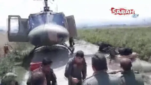 Helikopterle acil iniş yapan askeri personele köy halkından misafirperverlik örneği
