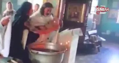 Kilisede yeni doğan bebeğe vaftiz sırasında papazdan işkence!