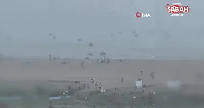 ABD’de şiddetli rüzgar şemsiyeleri okyanusa uçurdu | Video