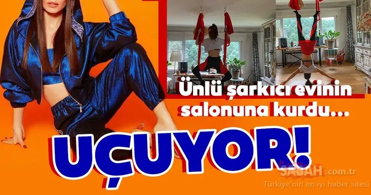 Ünlü şarkıcı Simge Sağın fit vücuduyla ilgi odağı oldu... Simge Sağın salonunun ortasında adeta uçuyor!