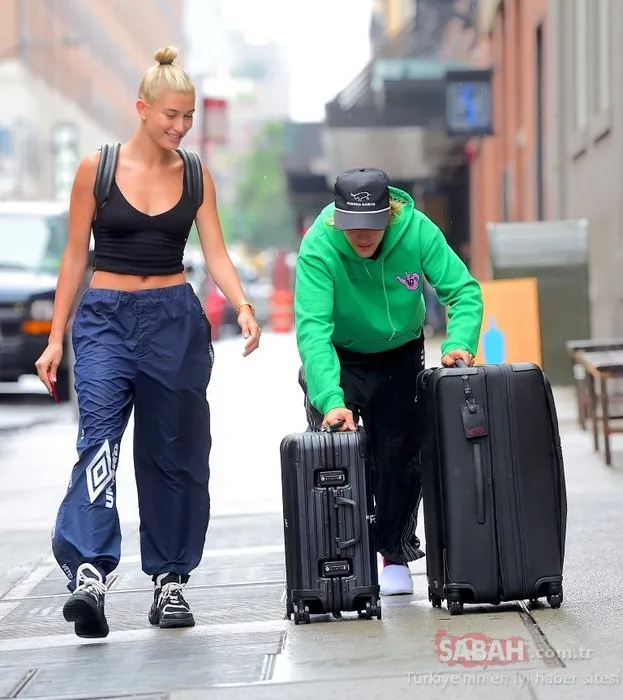 Ünlü model sevgilisine bavullarını taşıttı!