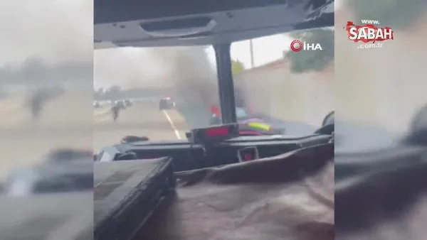 ABD polisi otoyolda yanan aracın sürücüsünü kurtardı | Video