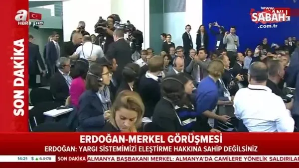Can Dündar'ın arkadaşı Adil Yiğit, Erdoğan-Merkel basın toplantısını provoke etti