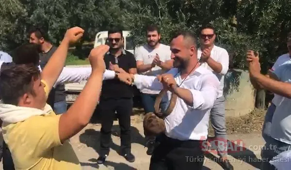 Boynuna öküz çanı takılan damat, el arabasıyla gezdirildi