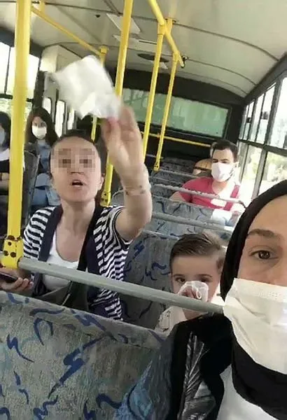 Maske takmayan kadın kendini uyaranlara saldırdı