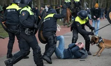 Hollanda polisinden orantısız güç! Göstericilerin üzerine köpek saldılar