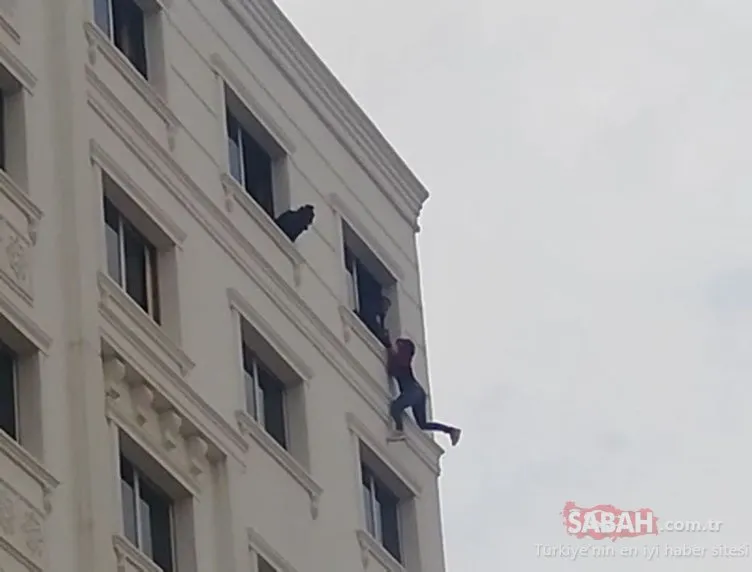 7’nci katta intihara kalkışan kadını polis son anda yakalayıp, kurtardı