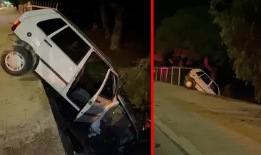SON DAKİKA... Mersin’de feci kaza! Kontrolden çıkan otomobil asılı kaldı: Sürücü son anda kurtuldu! #mersin