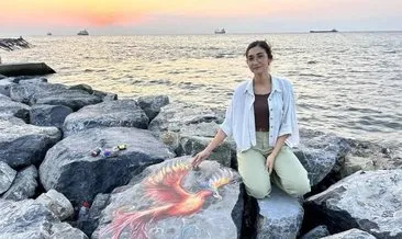 Enkazdan çıkan depremzede Edanur, şimdi sahildeki kayaları renklendiriyor #hatay
