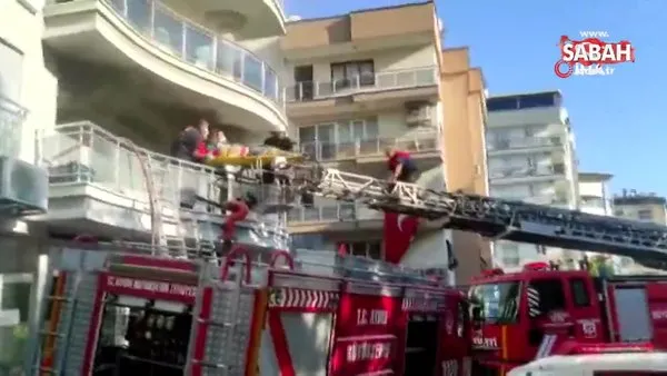 Yangında dumandan etkilenerek bayılan şahıs balkondan sedye ile kurtarıldı | Video