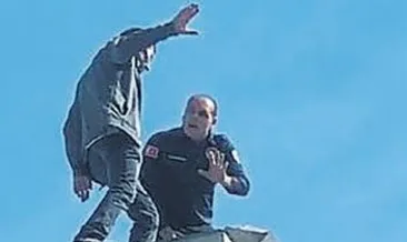 Parasını alamadı bina çatısına çıktı
