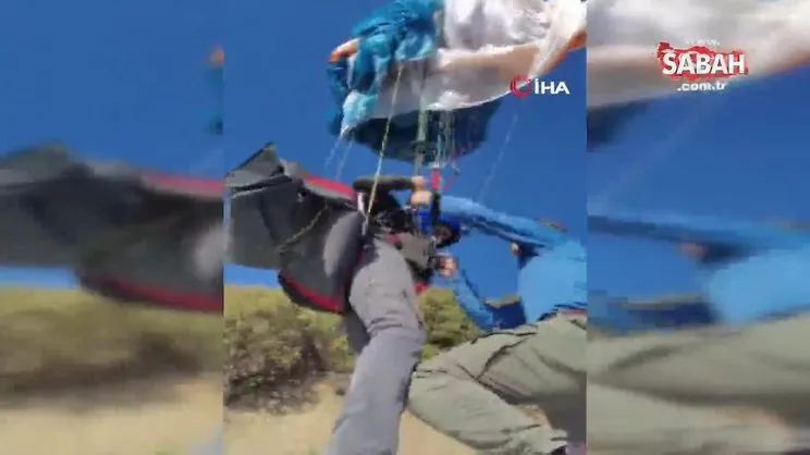 Elektrik tellerine takılı kalan paraşüt pilotu kurtarılmayı bekledi