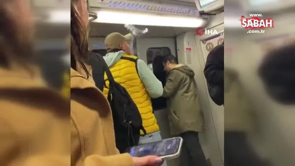 Böyle pişkinlik görülmedi! Metroda sigara içti, kendisini uyaranlara hakaret etti | Video