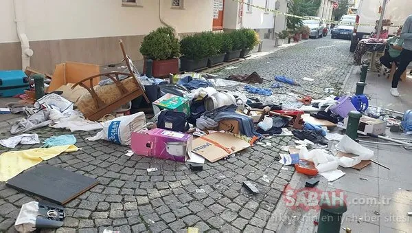 Evdeki eşyaları pencereden sokağa attı