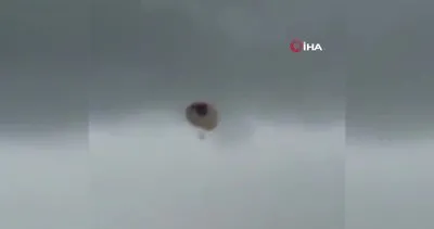 Paraşütün halatları kopunca elektrik tellerine takılan kadın kamerada
