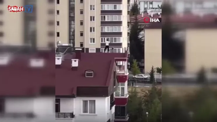 10 katlı binanın çatısında yürekleri ağza getiren hareketler kamerada | Video