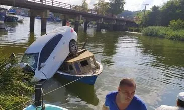 Düzce’de yoldan çıkan otomobil Melen Çayı’ndaki teknenin üzerine düştü