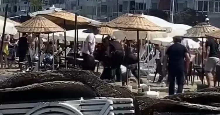 Bursa’da halk plajında şezlong kavgası! Tekme ve yumruklarla birbirlerine girdiler